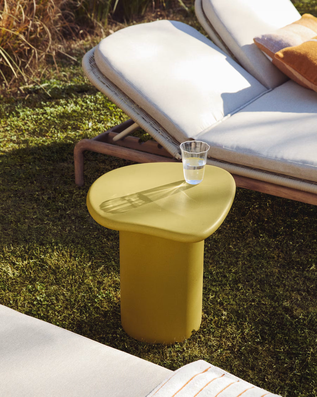 Macarella side table in mustard concrete 48 x 47cm.
