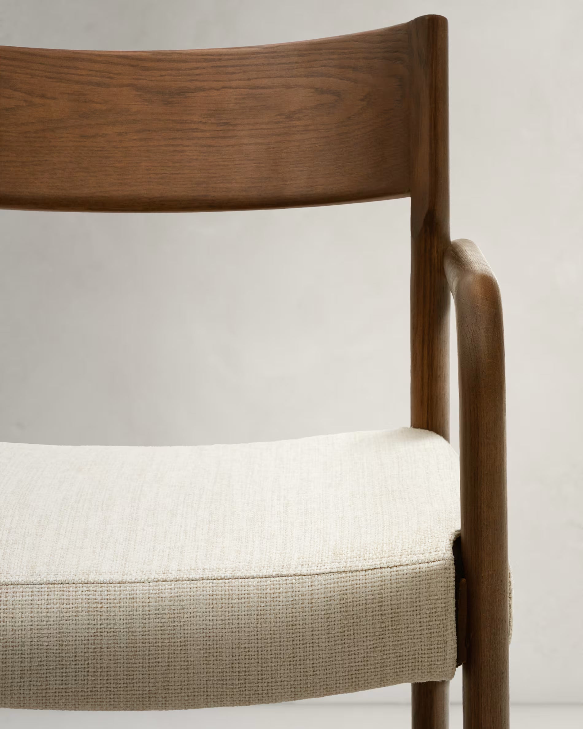 Falconera Chair in Walnut Finish.