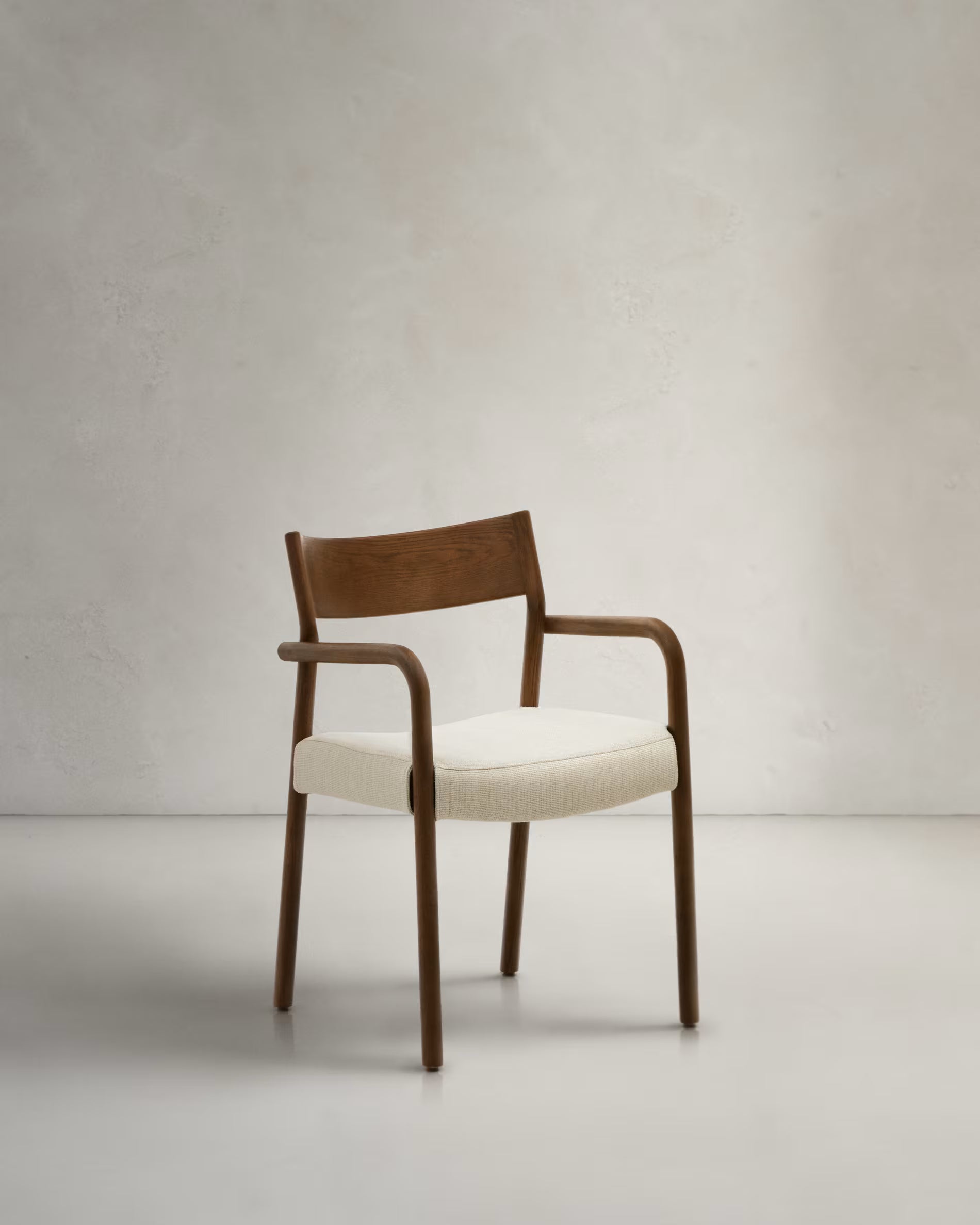 Falconera Chair in Walnut Finish.