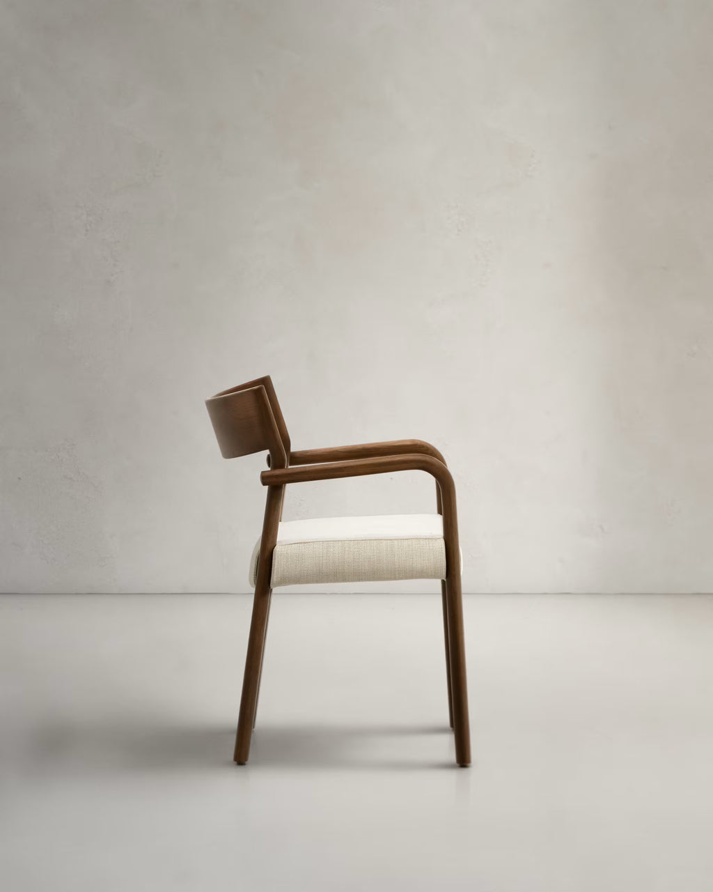 Falconera Chair in Walnut Finish.