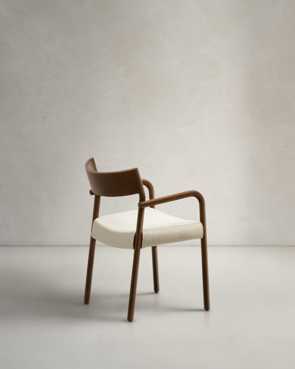 Falconera Chair in Walnut Finish.