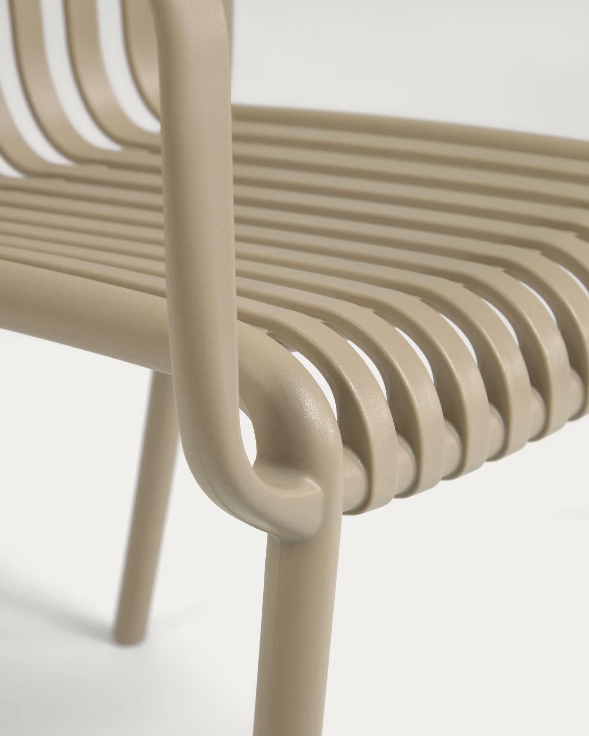 Isabellini stackable outdoor chair in beige.