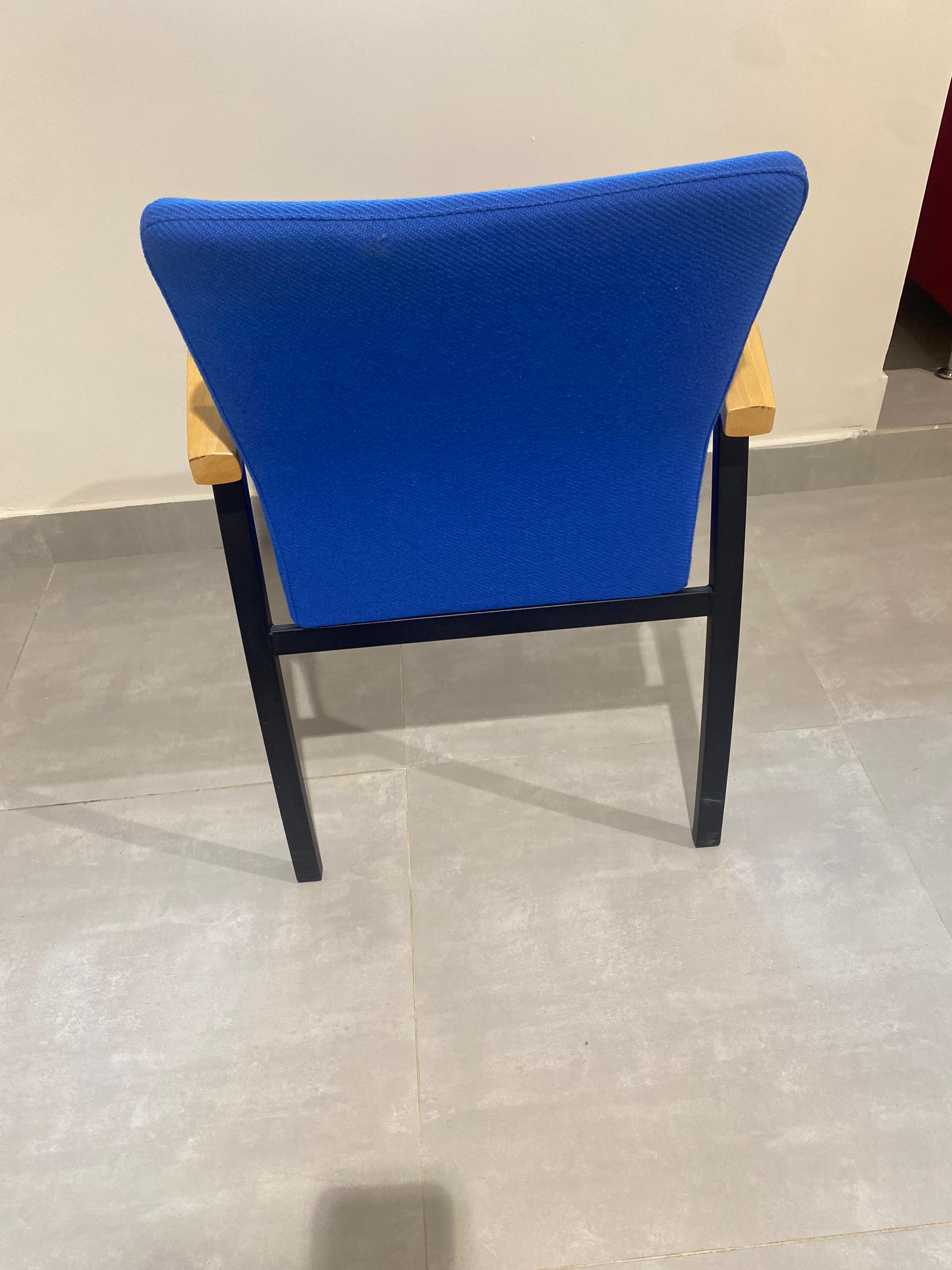 LIGHT BLUE CHAIRS ON BLACK FRAME WITH WOOD ARMREST FOR OFFICE, MEETING VENUE OR RECEPTION AREA